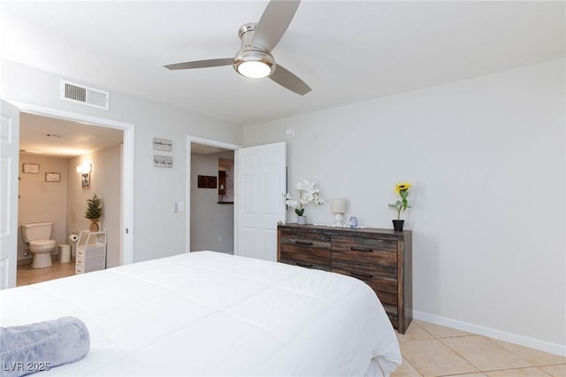 bedroom featuring baseboards, visible vents, connected bathroom, ceiling fan, and light tile patterned flooring