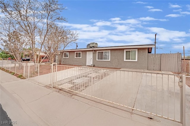 ranch-style house featuring a patio area, fence, and stucco siding