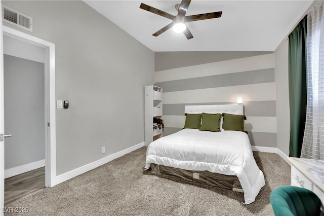 bedroom featuring carpet, lofted ceiling, visible vents, a ceiling fan, and baseboards