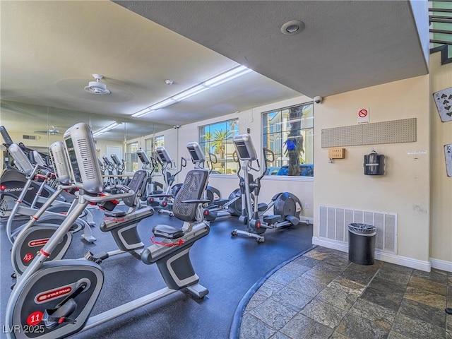 workout area featuring visible vents and baseboards