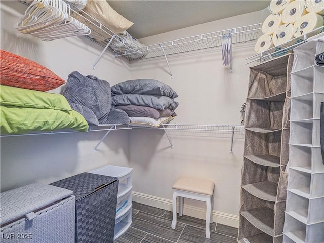 spacious closet featuring wood finish floors