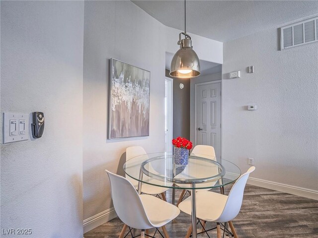 7111 S Durango Dr Unit 305, Las Vegas, NV 89113 - dining space featuring wood finished floors and a textured wall