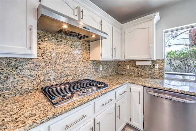 kitchen featuring white cabinetry, appliances with stainless steel finishes, and exhaust hood