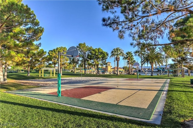 view of basketball court with community basketball court and a yard