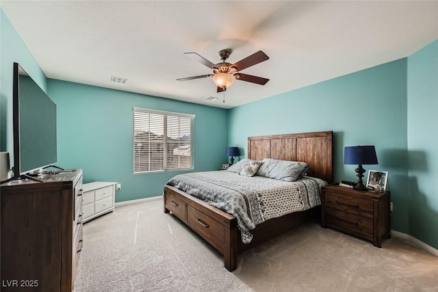 bedroom featuring baseboards, ceiling fan, visible vents, and light colored carpet