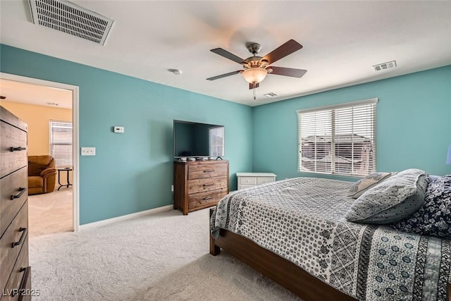 bedroom featuring a ceiling fan, baseboards, visible vents, and carpet flooring