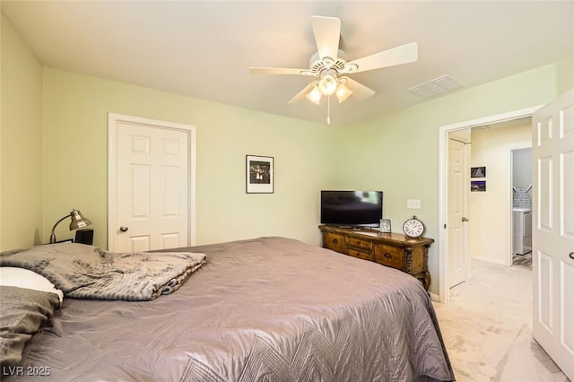 bedroom featuring light carpet, a ceiling fan, and baseboards