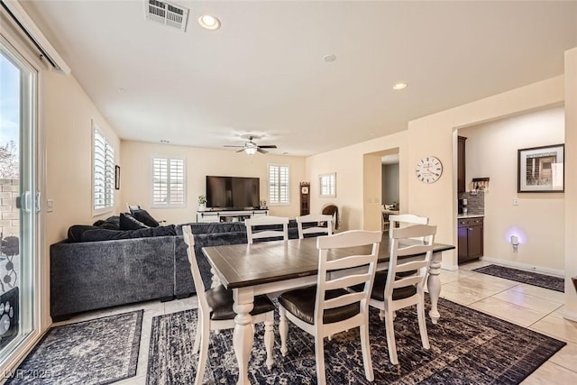 dining room with light tile patterned floors, ceiling fan, visible vents, and recessed lighting