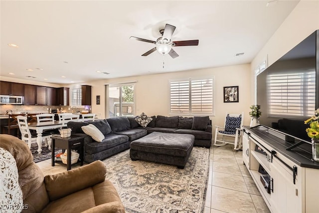 living area with recessed lighting, visible vents, ceiling fan, and light tile patterned floors