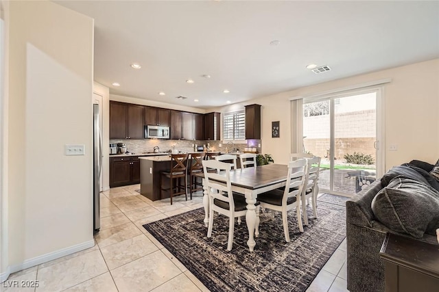 dining room featuring recessed lighting, visible vents, baseboards, and light tile patterned floors