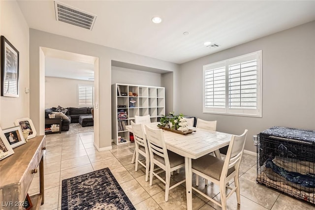 dining space with light tile patterned floors, baseboards, visible vents, and recessed lighting