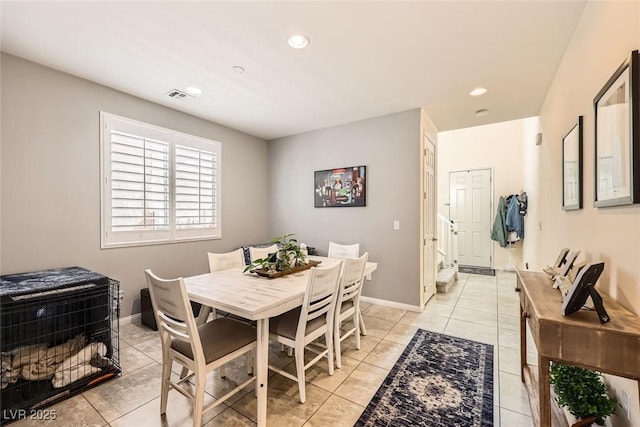 dining area featuring light tile patterned floors, baseboards, visible vents, and recessed lighting