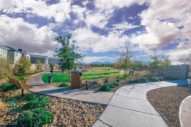 view of home's community featuring a lawn