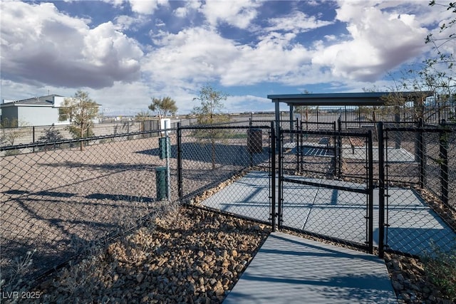 view of gate with fence