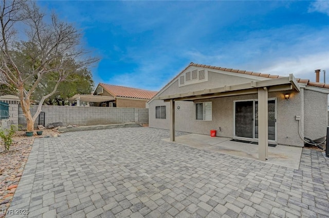 back of property featuring a patio area, a fenced backyard, and stucco siding