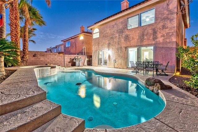 view of pool with a fenced in pool, a patio, and fence