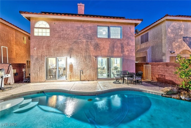 view of pool featuring a patio, fence, and a fenced in pool