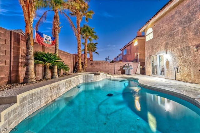 view of pool with a fenced backyard, a fenced in pool, and a patio