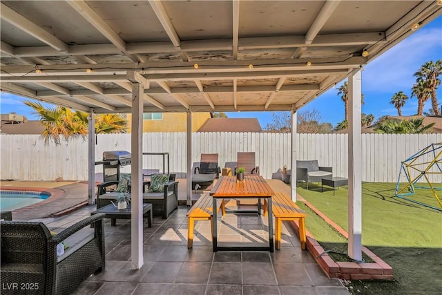 view of patio / terrace featuring a fenced backyard, an outdoor hangout area, a fenced in pool, and outdoor dining space