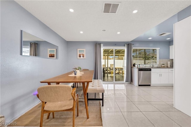 dining room with recessed lighting, visible vents, and light tile patterned flooring