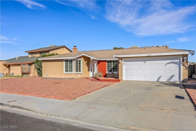 single story home with driveway, a chimney, an attached garage, and stucco siding