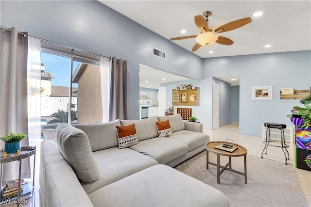 living room featuring light tile patterned floors, visible vents, ceiling fan, vaulted ceiling, and recessed lighting