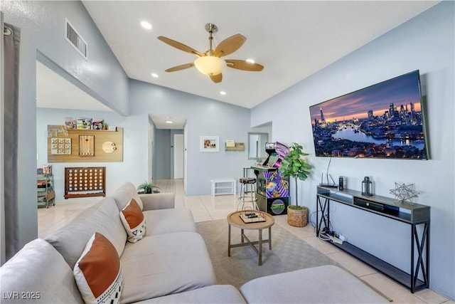 living room with light tile patterned floors, visible vents, a ceiling fan, vaulted ceiling, and recessed lighting