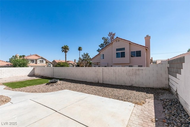 exterior space featuring a fenced backyard