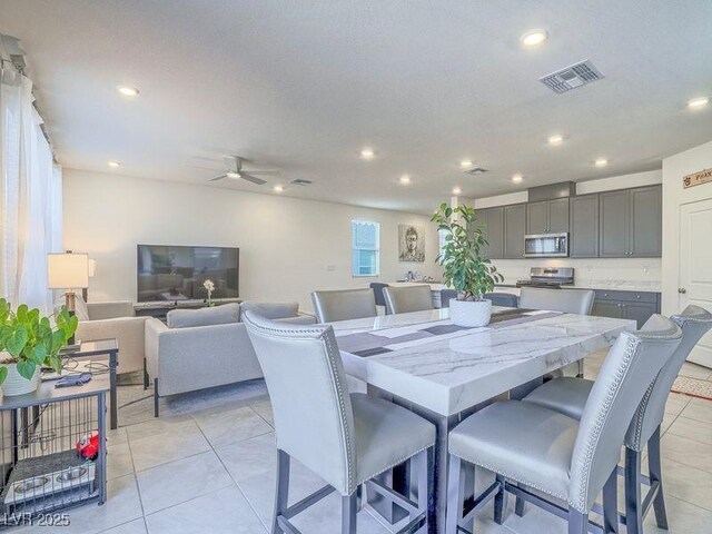 dining space featuring light tile patterned floors, visible vents, recessed lighting, and ceiling fan