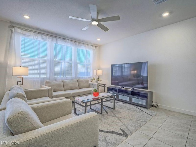 living room featuring tile patterned floors, baseboards, ceiling fan, and recessed lighting