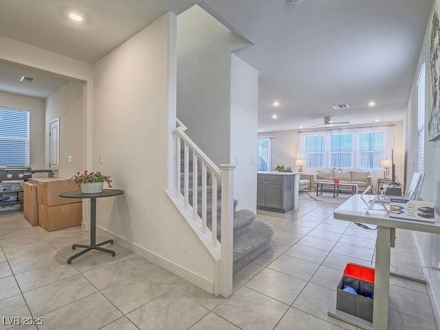 staircase featuring tile patterned floors, recessed lighting, visible vents, and baseboards