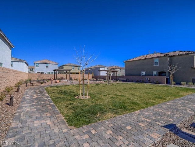 view of yard featuring a gazebo and a fenced backyard