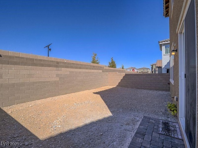 view of yard featuring a patio area and a fenced backyard