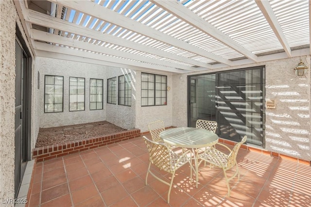 view of patio featuring outdoor dining area and a pergola