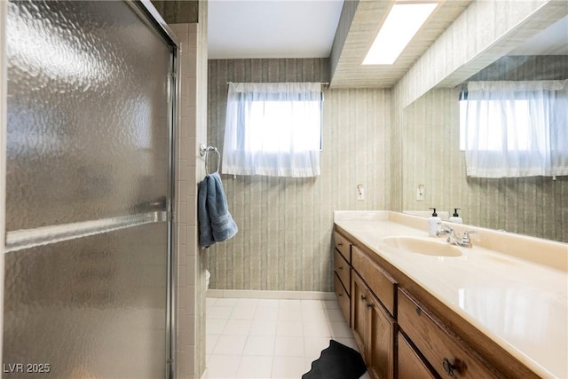 full bath featuring a stall shower, tile patterned floors, and vanity