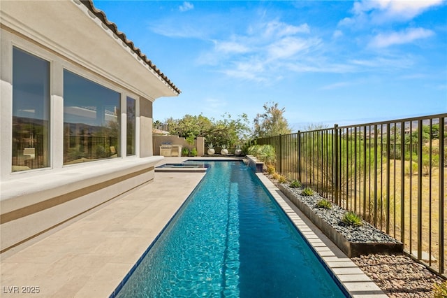 view of pool with a patio area, a fenced backyard, and a fenced in pool