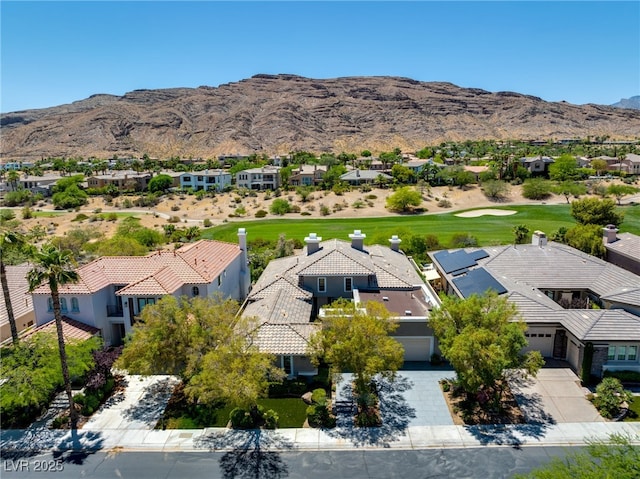 birds eye view of property with a mountain view and a residential view