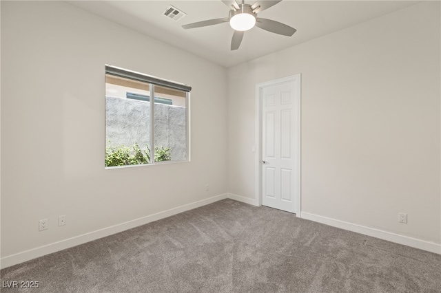 unfurnished room featuring a ceiling fan, visible vents, baseboards, and carpet flooring