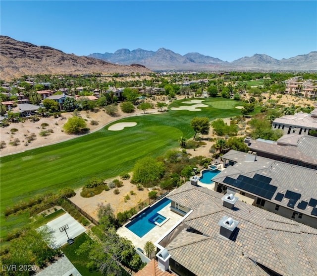 aerial view featuring a mountain view and golf course view