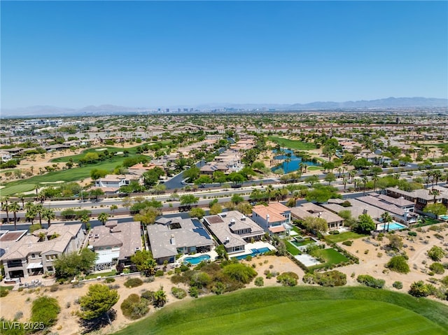 birds eye view of property with a mountain view, view of golf course, and a residential view