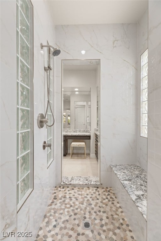 full bathroom featuring tile patterned floors, walk in shower, and vanity