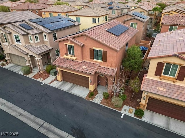 birds eye view of property with a residential view