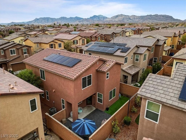 drone / aerial view with a mountain view and a residential view