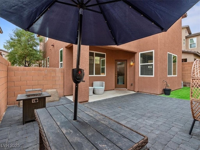 view of patio / terrace featuring fence