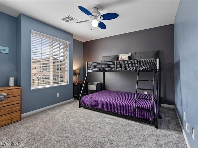 bedroom with a ceiling fan, baseboards, visible vents, and carpet flooring