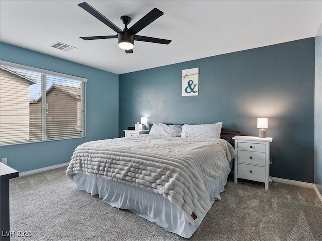 bedroom featuring ceiling fan, carpet flooring, visible vents, and baseboards