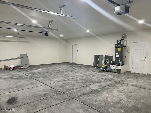 garage with a garage door opener and water heater