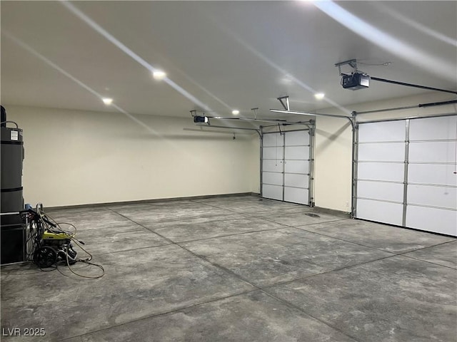 garage with baseboards and a garage door opener