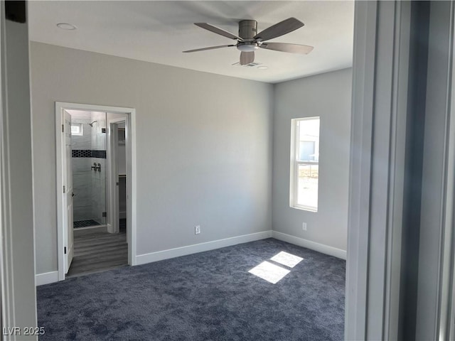 unfurnished bedroom featuring carpet flooring, connected bathroom, baseboards, and ceiling fan