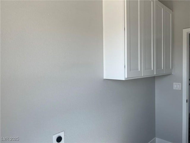 laundry room with cabinet space and hookup for an electric dryer